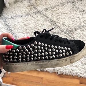 Black and green studded sneakers